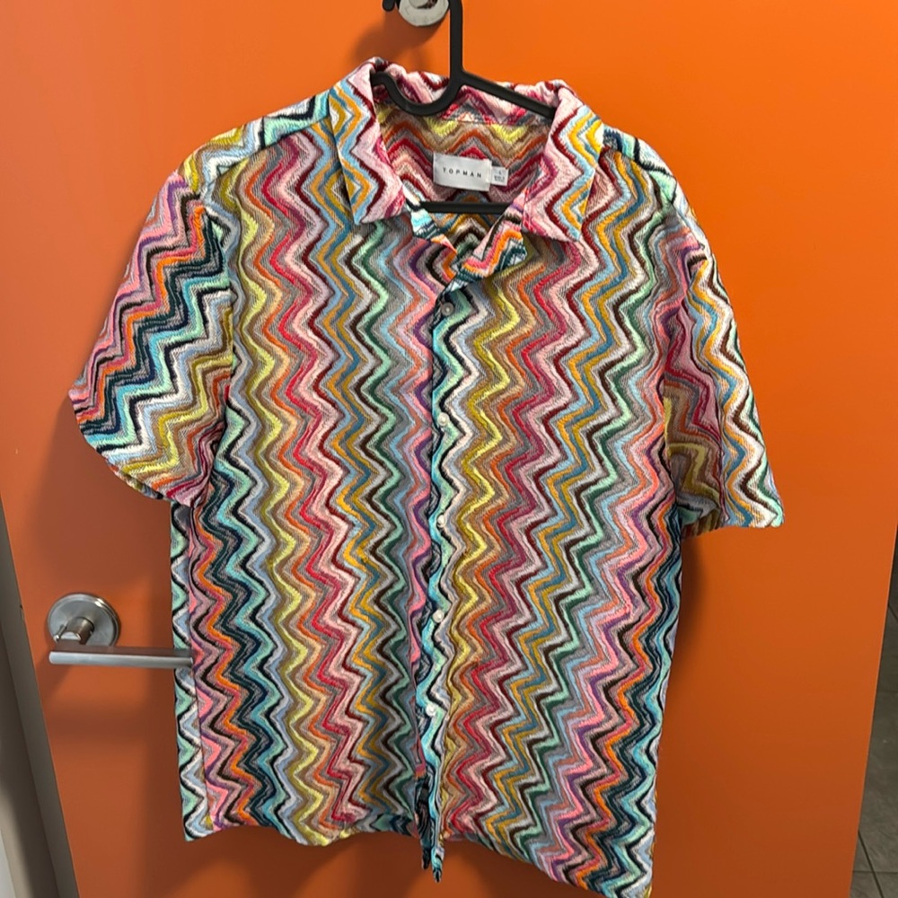 Multicolored button down shirt, size large, fits like a medium